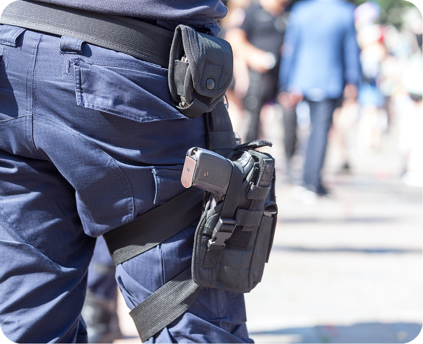 Tactical leg holster and sidearm detail representing elite armed guard readiness.